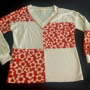 Bibi long sleeved block design top. Size medium. New